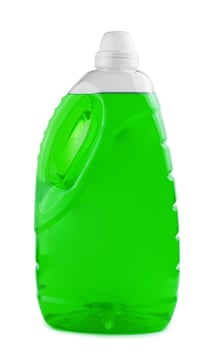 Green liquid soap or detergent in a plastic bottle photo