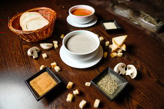 Wooden Table Adorned With Assorted Food Bowls photo