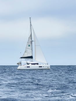 a catamaran sailing in the open ocean photo