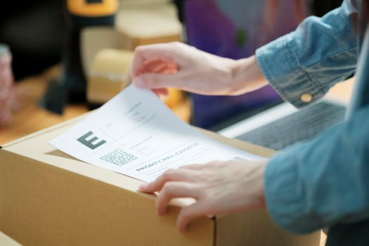 Attaching Shipping Label to a Parcel photo