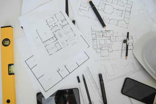 architect design working drawing sketch plans blueprints and making architectural construction model in architect studio,flat lay. photo
