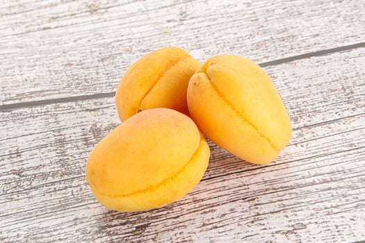 Ripe sweet juicy apricot heap photo