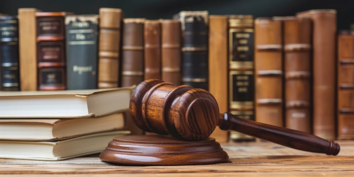 AI generated Symbol of Authority. Wooden Gavel Resting on Books atop a Wooden Table, Evoking the Essence of Law and Legal Practice. photo