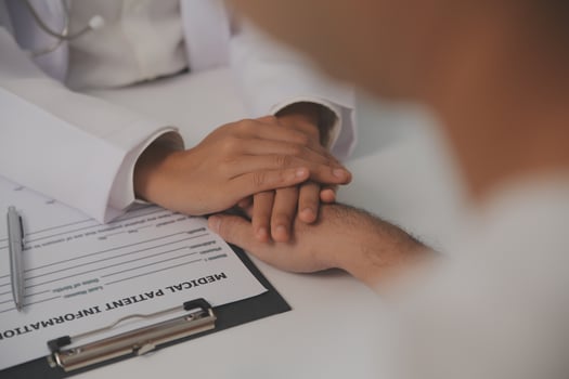 Homecare nursing service and elderly people cardiology healthcare. Close up of young hispanic female doctor nurse check mature caucasian man patient heartbeat using stethoscope during visit photo
