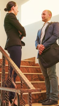 Business people meeting on stairs in finance corporate company shaking hands and talking. Team of professional businesspeople working together in modern financial building greeting. photo