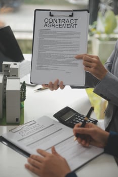 Business Signing a Contract Buy - sell house, insurance agent analyzing about home investment loan Real Estate concept. photo
