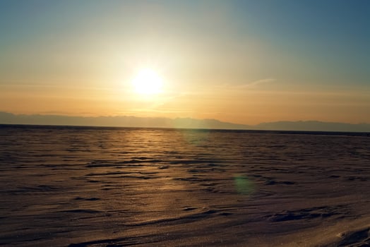 winter landscape of Lake Baikal. Beautiful mountains in the snow and sky photo