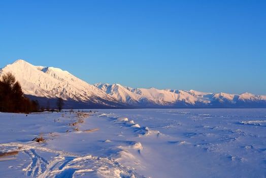 winter landscape of Lake Baikal. Beautiful mountains in the snow and sky photo