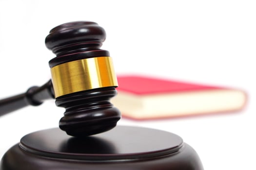 Close up of judge gavel, lawyer, law, justice with law book in background. photo