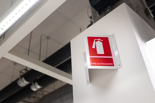 Fire extinguisher station sign on white wall. fire extinguisher sign in the building. Emergency sign. photo