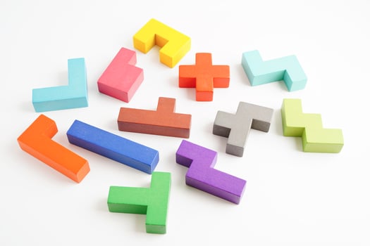Logical thinking and problem solving problem solution creative business concept, wooden puzzle geometric block shape. photo