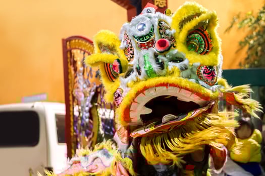 A yellow Chinese lion dancer dress rehearsal performance before the Chinese New Year on 15th Feb 2018. photo