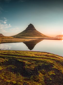 Kirkjufell volcanic mountain reflect on lake in the morning at Iceland photo