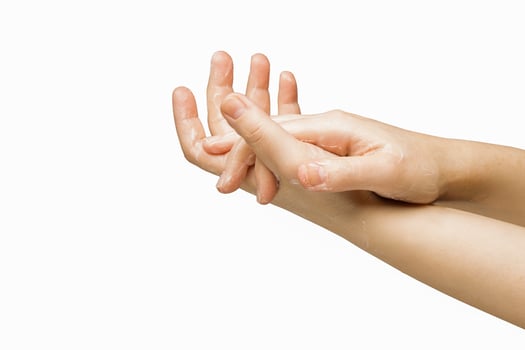 hands a girl who uses a skin care cream, image on a white background. High quality photo