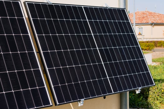 Solar panels on a well-exposed wall of an individual house, making savings following the energy crisis, eco-citizen gesture, green energy photo