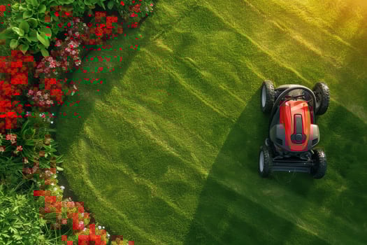 AI generated A gasoline lawn mower stands on the lawn near the house at sunset photo