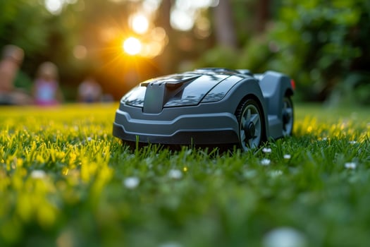 AI generated A robotic lawn mower stands on the lawn near the house at sunset photo