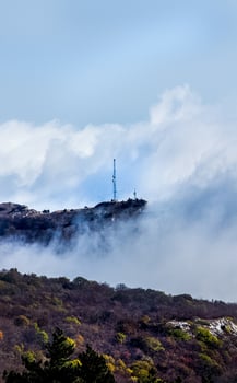 Low clouds over valley, view from the mountains. Low clouds. photo