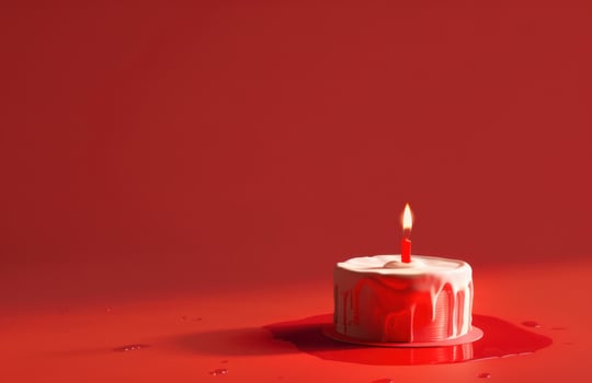 AI generated a birthday cake and candle, with a birthday message on a red background, light red and crimson photo