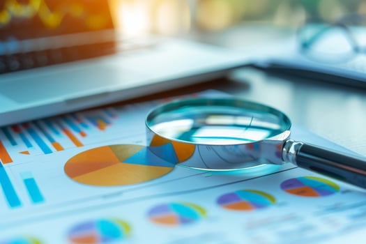 AI generated magnifying glass on financial chart. generated AI photo