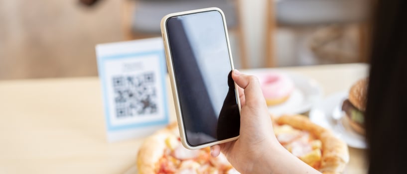 Woman use smartphone to scan QR code to pay in cafe restaurant with a digital payment without cash. Choose menu and order accumulate discount. E wallet, technology, pay online, credit card, bank app photo