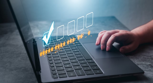 Woman use laptop to rate a service online. Customer review concept. Business rating experience. Satisfaction survey concept. 5 stars satisfaction. photo