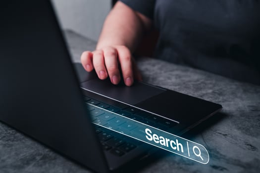 Woman use laptop with VR search bar. SEO. Browser technology. Concept of searching on internet with copy space. photo