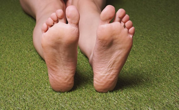 soles of feet of barefoot female person photo