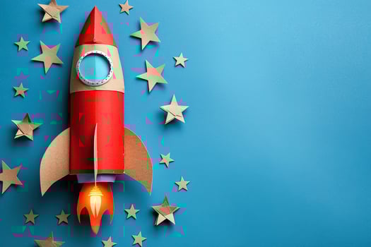 AI generated flying rocket made of cardboard and paper stars on a blue background with copy space photo
