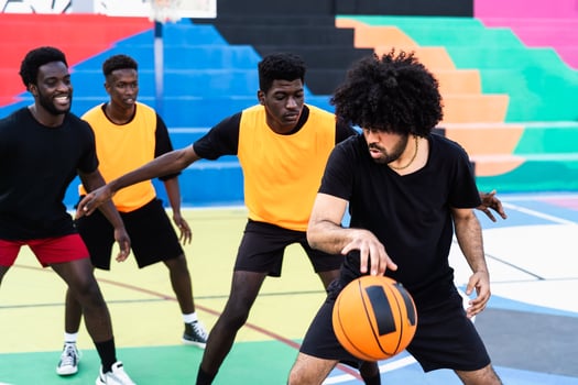 Young friends playing basketball outdoor - Urban sport lifestyle concept photo