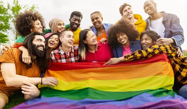 Happy diverse young friends celebrating gay pride day - LGBTQ community concept photo