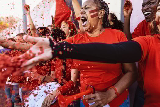 Football fans having fun supporting favorite team - Soccer sport entertainment concept photo