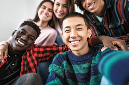 Young multiracial friends taking selfie together - Friendship and diversity concept photo