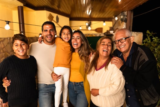 Happy Hispanic family enjoying holidays together at home photo