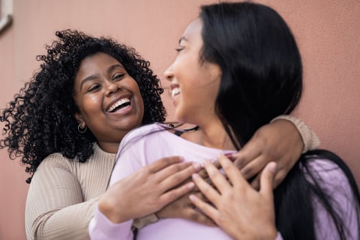 Happy Latin girls having fun embracing outdoor - Young people lifestyle and friendship concept photo