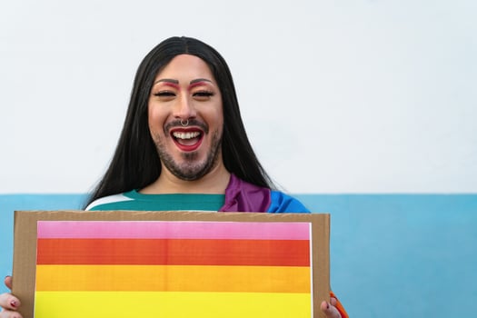 happy drag queen activist having fun during gay pride parade - LGBT social movement concept photo