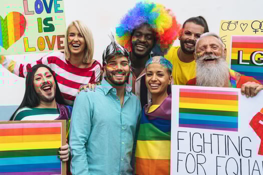 Happy Multiracial people celebrating at gay pride event - Group of friends with different age and race fighting for gender equality - Lgbt protest concept photo