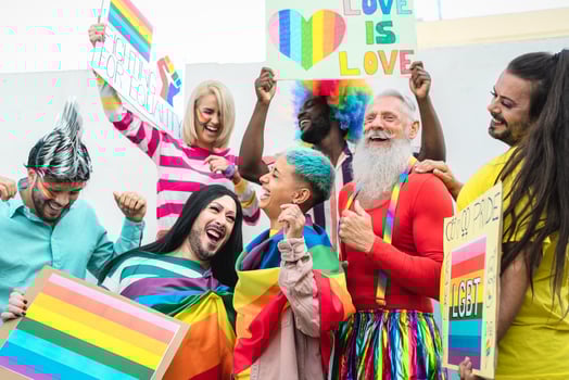 Happy Multiracial people celebrating gay pride event - Group of friends with different age and race having fun during LGBT social event photo