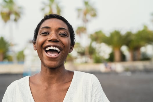 Happy African having fun during summer vacation on the beach photo