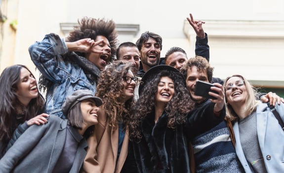 Young people taking selfie with mobile smartphone outdoor - Happy friends having fun with social media app - Youth millennial and technology concept photo
