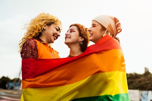 Happy young girls celebrating gay pride festival - LGBT community concept photo