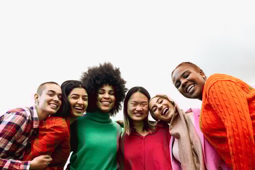 Happy young multi ethnic women having fun hanging out in the city - Diversity and friendship concept photo