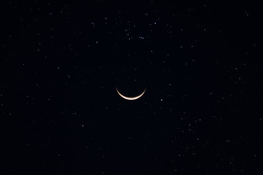 Crescent moon in the dark night. photo