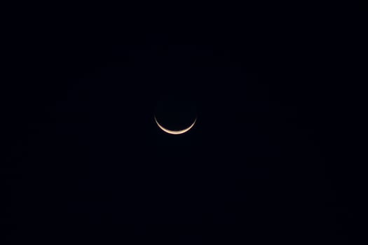 Crescent moon in the dark night. photo