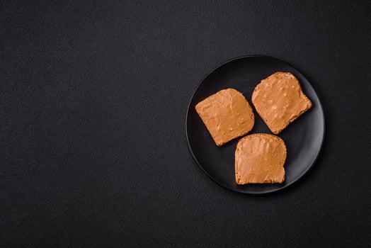 Delicious hearty sandwich with toast bread and peanut butter photo