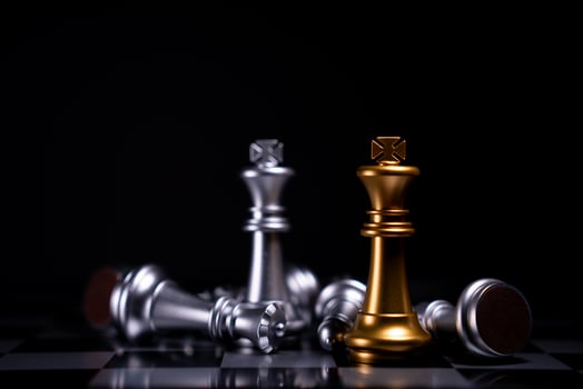 Golden and Silver King chess is last standing in the chess board, Concept of successful business leadership, Confrontation and loss photo