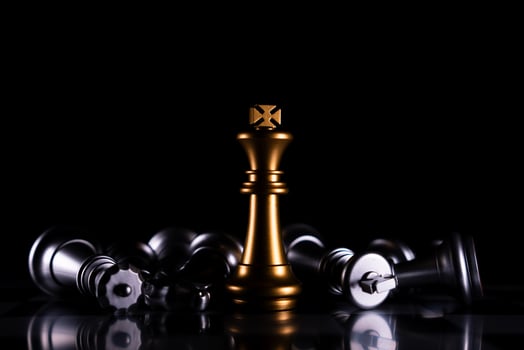 Golden King chess is last standing in the chess board, Concept of successful business leadership photo