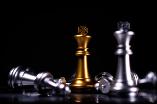 Golden and Silver King chess is last standing in the chess board, Concept of successful business leadership, Confrontation and loss photo