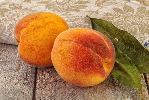Two ripe sweet peaches fruit photo