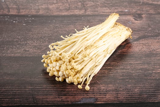 Tasty raw enoki mushroom heap photo